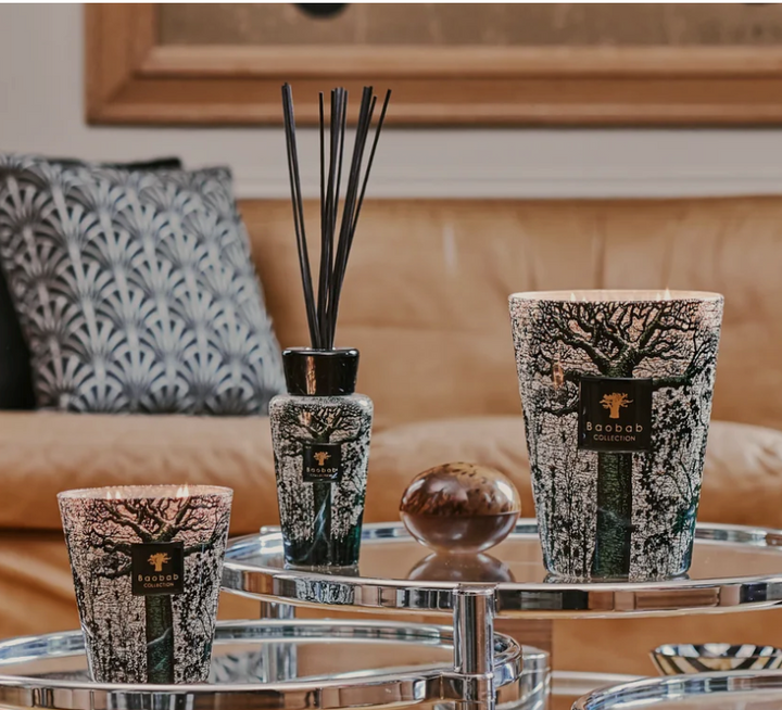African Legacy Collection of Candles and Diffusers on coffee table in a hi-end luxury home