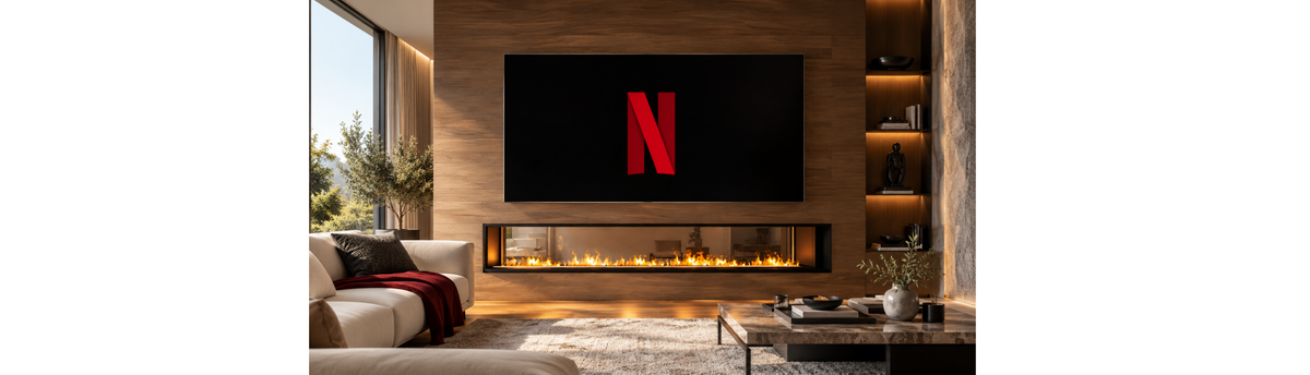 Long linear fireplace below TV in a luxury living room, showing fireplace scale and proportion