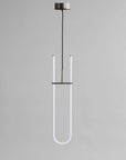 Modern pendant light with a U-shaped design on a gray background