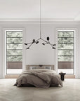 A Wabi Sabi theme bedroom interior with a minimal chandelier hanging from the ceiling.