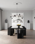 A Scandinavian theme dining room styled with wall art, sculptural vases , bowl, wall art and a minimal design chandelier.