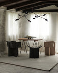 A Scandinavian theme dining room styled with bowl,and a minimal design chandelier.