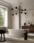 Modern bathroom with a freestanding bathtub, wooden cabinet, and decorative lighting fixture.
