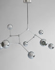Modern chandelier with geometric design on a gray background from 101 Copenhagen available at Spacio retail stores in Mumbai & Kolkata.