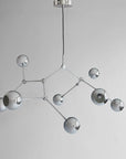 Modern chandelier with geometric design on a gray background from 101 Copenhagen available at Spacio retail stores in Mumbai & Kolkata.