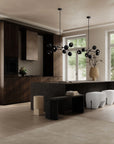 Modern living room with dark wood furniture, white ottomans, and large windows.
