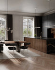 Modern kitchen and dining area with a glass table and black chairs.
