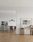 A Scandinavian theme ineriors styled with wall art, sculptural vases , bowl, wall art and a minimal design chandelier.