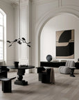 A Scandinavian theme dining room styled with wall art, sculptural vases , bowl and a minimal design chandelier.