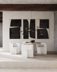 A Scandinavian theme dining room styled with bowl, wall art and a minimal design chandelier.