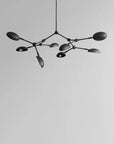 A modern chandelier with 8 arms from 101 Copenhagen available at Spacio retail stores in Mumbai & Kolkata.