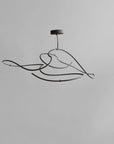 Modern pendant light fixture on a gray background from 101 Copenhagen available at Spacio retail stores in Mumbai & Kolkata.