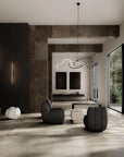 Modern living room with gray sofa, coffee table, and decorative items.