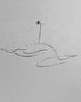 Modern pendant light with wavy design on a gray background