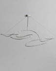 Modern pendant light with wavy design on a gray background