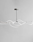 Modern pendant light with white curved design on a gray background from 101 Copenhagen available at Spacio retail stores in Mumbai & Kolkata.