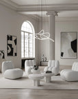 Modern living room with white furniture and abstract art