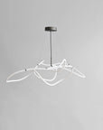 Modern pendant light with white curved design on a gray background