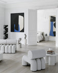 Modern living room with white furniture and abstract art