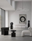 Modern interior design with white furniture and black accents