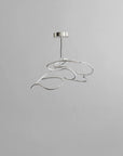 Modern pendant light with a silver finish on a gray background