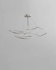 Modern pendant light fixture on a gray background