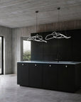 Modern kitchen with black island and concrete walls and floor