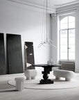 Modern interior design with black and white furniture in a bright room.