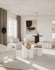 Modern living room with white furniture and neutral decor