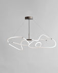 Modern pendant light with white geometric design on a gray background