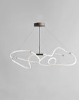 Modern pendant light with white geometric design on a gray background