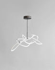 Modern pendant light with white curved design on a gray background