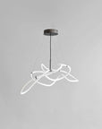 Modern pendant light with white curved design on a gray background