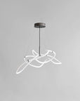 Modern pendant light with white circular design on a gray background