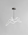 Modern pendant light with white circular design on a gray background