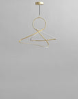 Brass chandelier on a gray background from 101 Copenhagen available at Spacio retail stores in Mumbai & Kolkata.