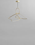 Gold pendant light fixture on a gray background