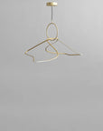 Gold pendant light fixture on a gray background