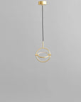 Minimal Scandinavian design Brass pendant light on a gray background from 101 Copenhagen available at Spacio retail stores in Mumbai & Kolkata.