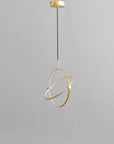 Brass pendant light fixture on a gray background
