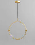 Brass circular pendant light on a gray background