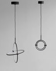 Two modern pendant lights with circular designs on a gray background