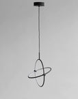 Modern black pendant light on a gray background