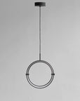 Modern pendant light with circular design on a gray background