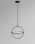 Modern black pendant light on a gray background