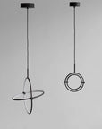 Two modern pendant lights with circular designs on a gray background
