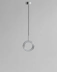 Modern pendant light with circular design on a gray background