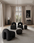 Modern Japandi theme living room with furniture, sculptural vase, pendant light and large windows.