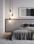 Modern Japandi theme bedroom with gray bedding, abstract art, and pendant lights.