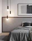 Modern Japandi theme bedroom with gray bedding, abstract art, and pendant lights.